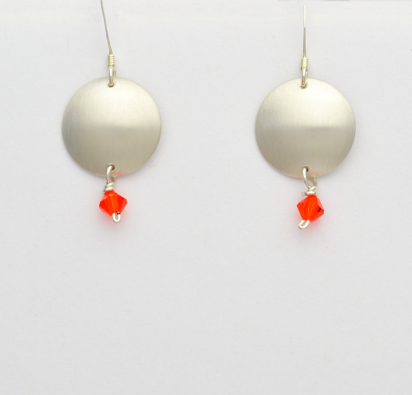 Journey Brushed Silver Disc Dangle Earrings with Orange Crystal